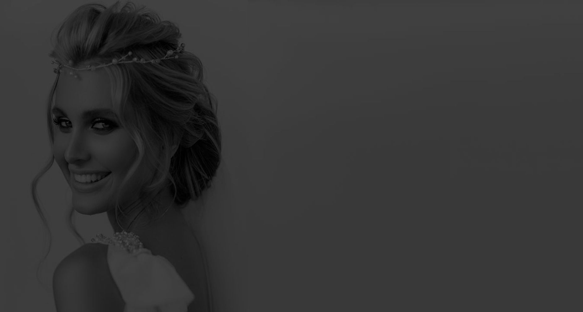 Smiling woman with stylish hair and makeup.