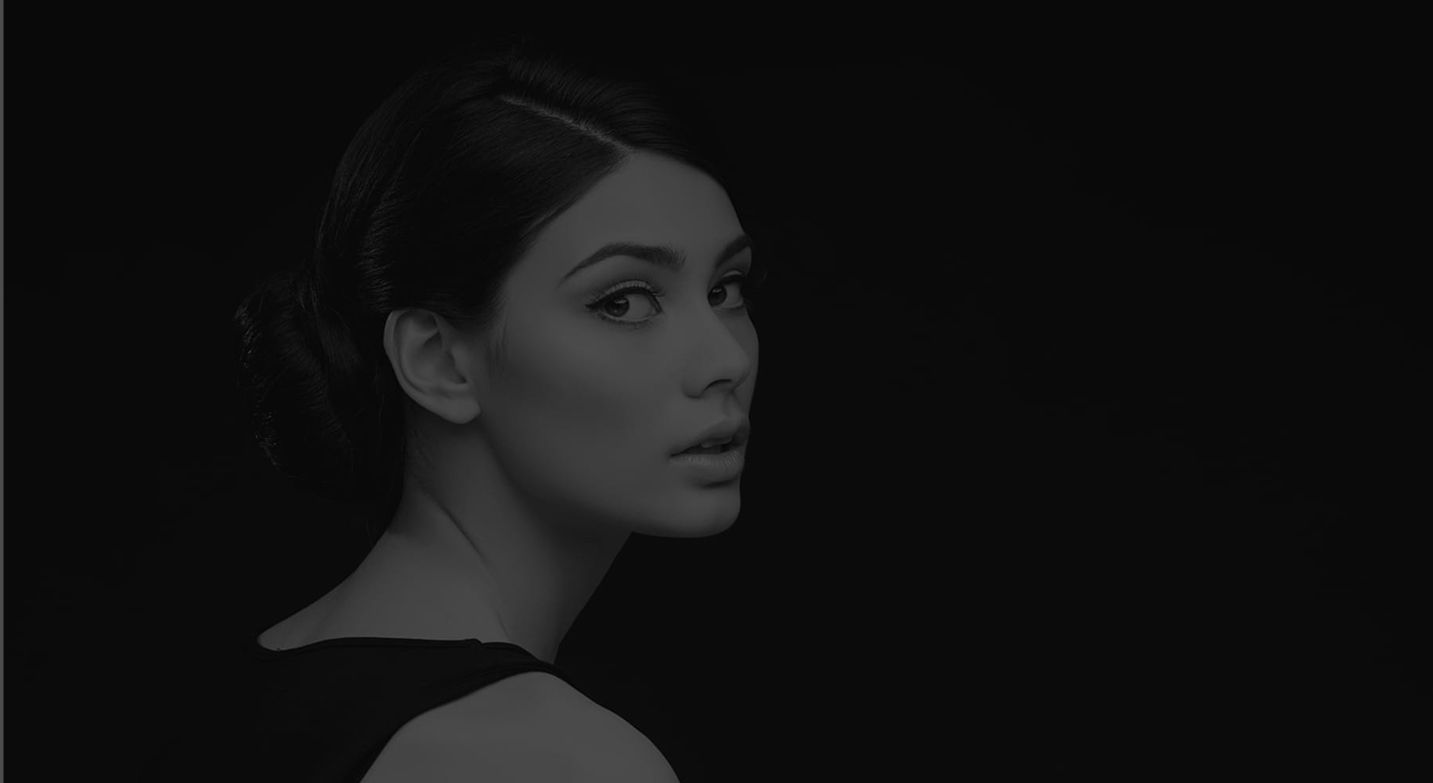 Profile of a woman with elegant hairstyle.