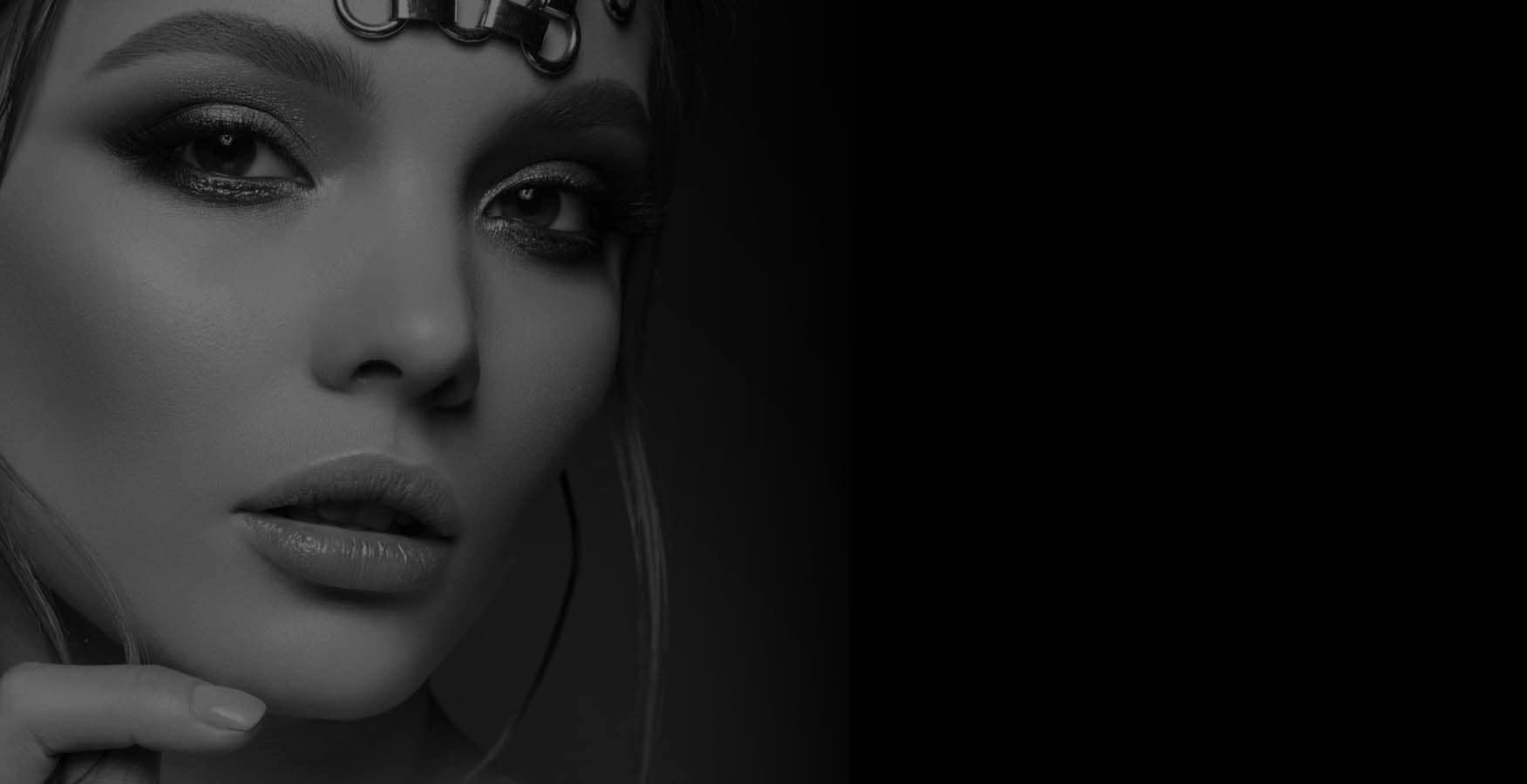 Close-up of a stylish woman in black and white.