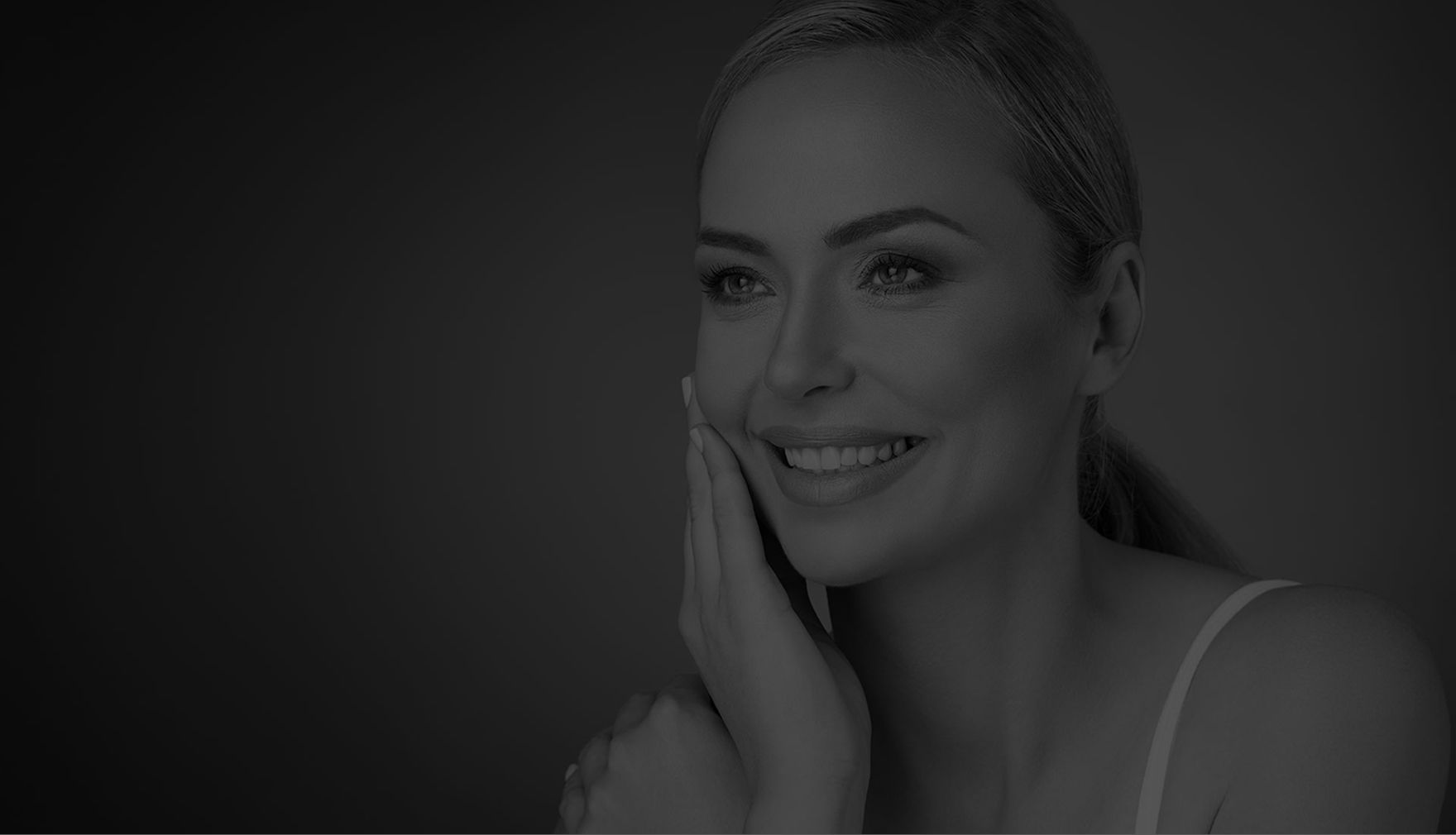 Woman with striking features and bold earrings.