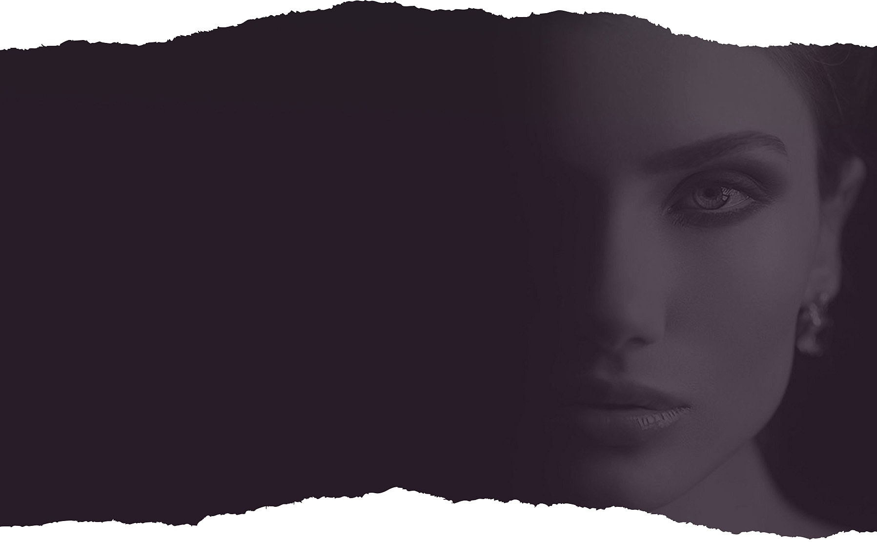 Close-up of a woman's face in shadow.