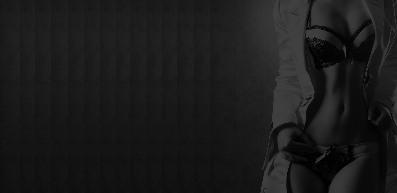 Elegant figure in lingerie with subtle lighting.