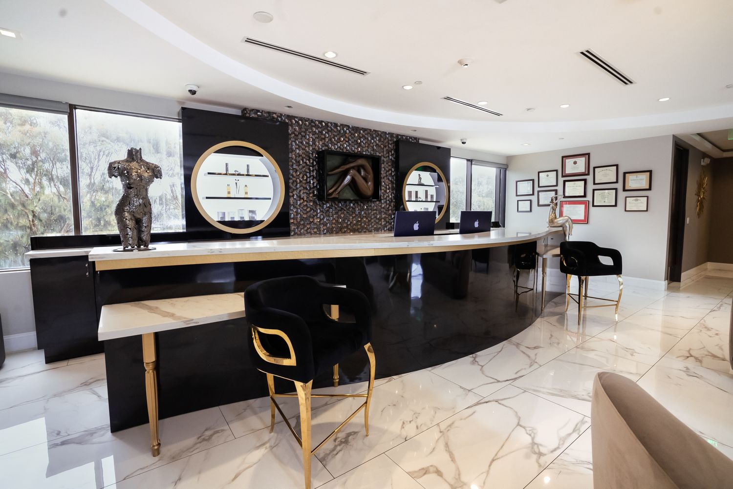 Modern reception area with elegant decor and furniture.