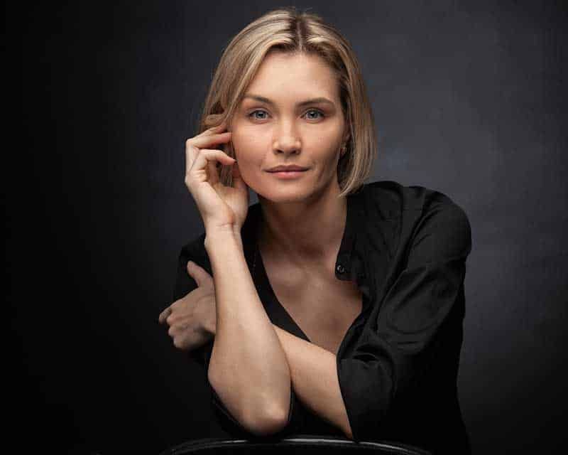 Portrait of a woman with soft, thoughtful expression.