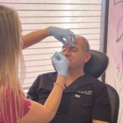 Administering treatment in a clinical setting.