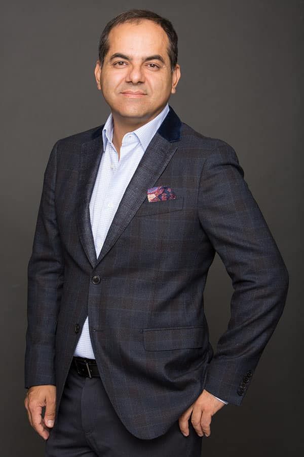 Plastic surgeon in stylish suit jacket.