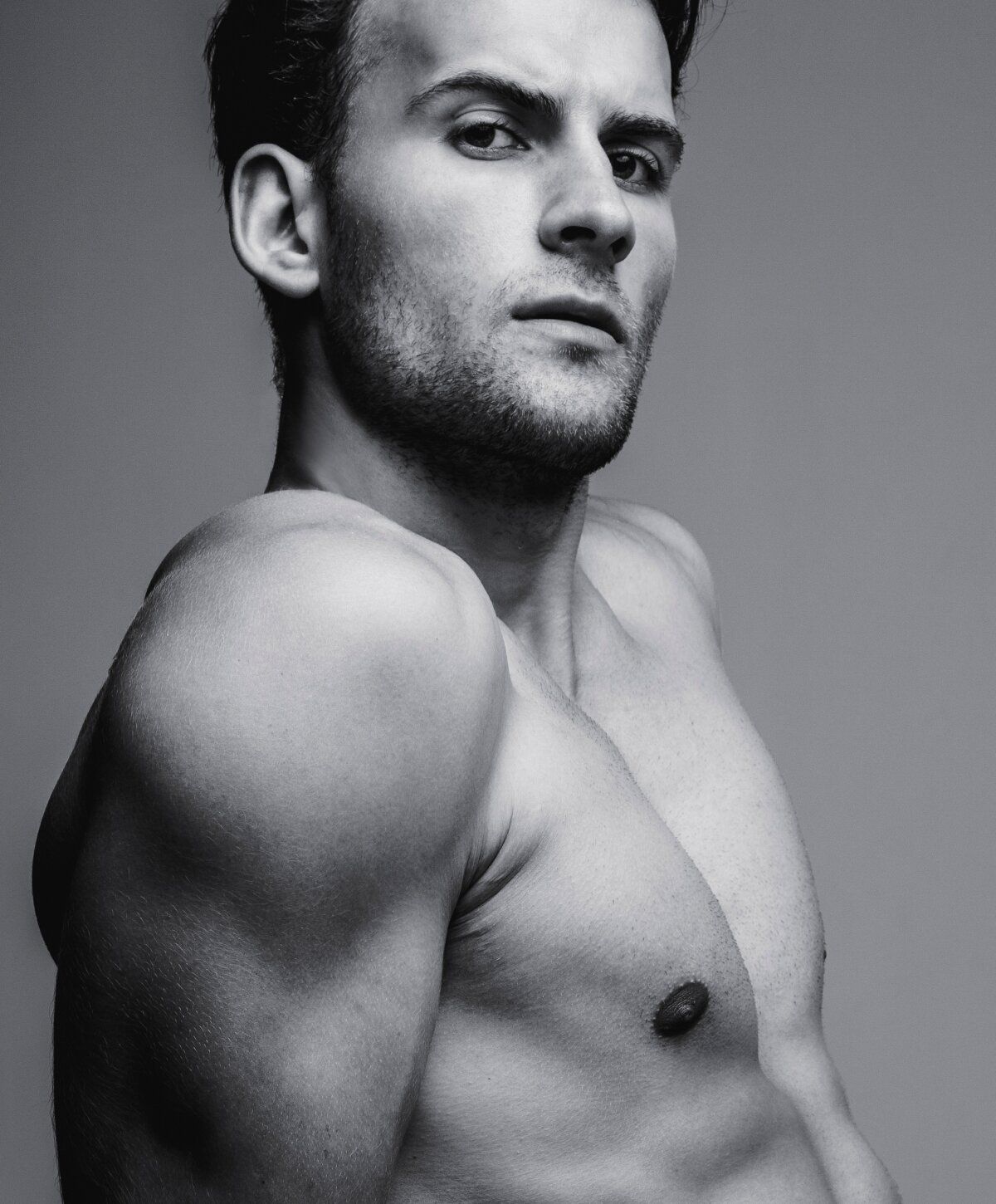 Black and white portrait of muscular man.