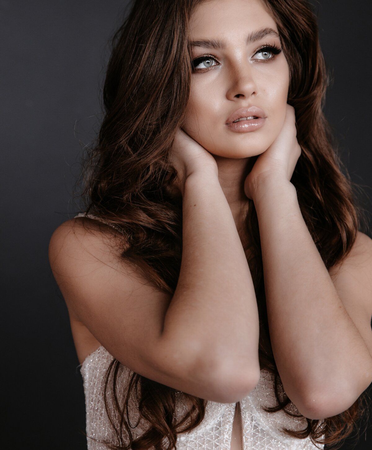 Model with long hair and expressive gaze.