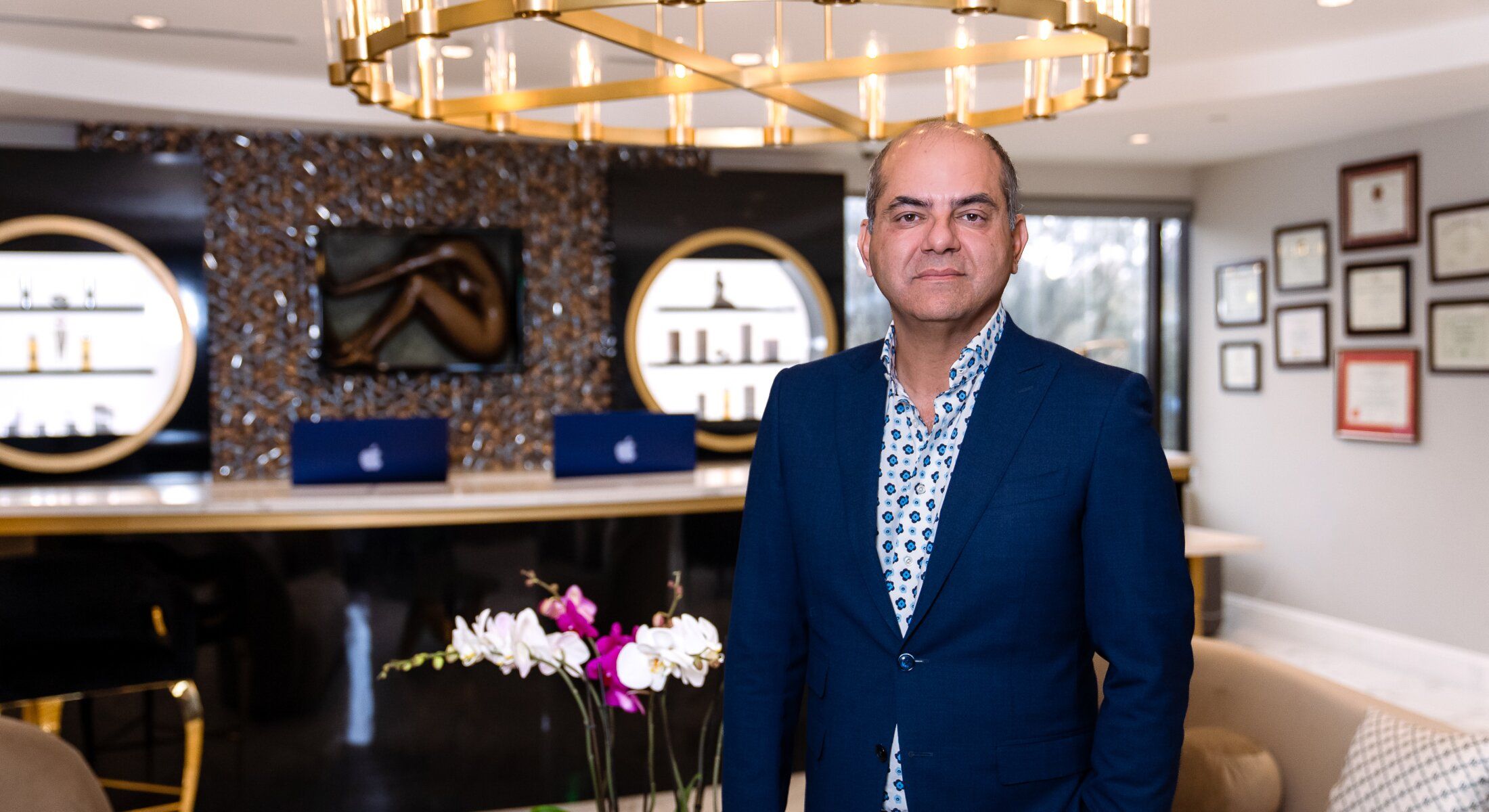 Professional individual in modern, elegant office setting.