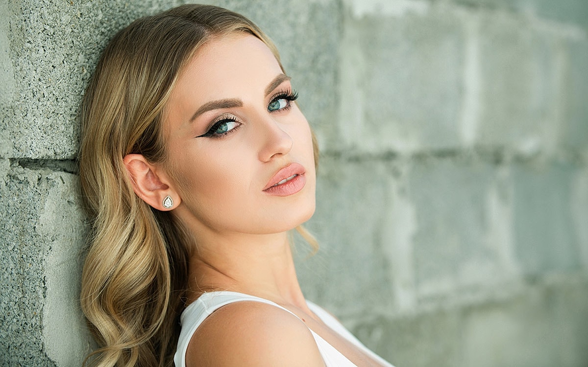 Portrait of a woman with striking blue eyes.