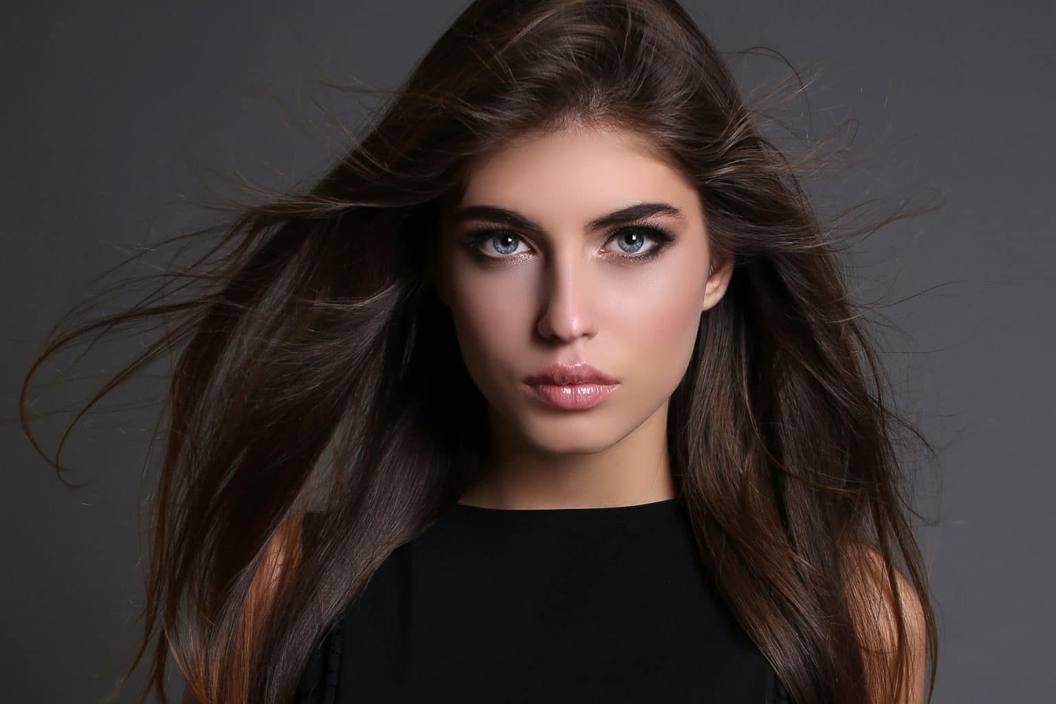 Portrait of a woman with flowing hair.