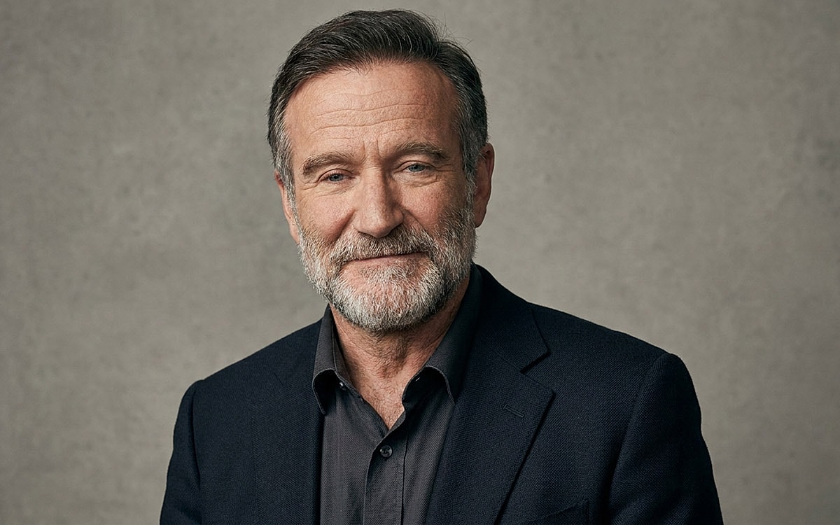 Portrait of a smiling man with a beard.