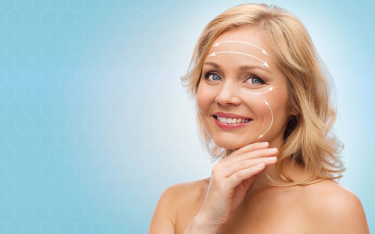 Woman demonstrating facial skincare techniques and arrows.