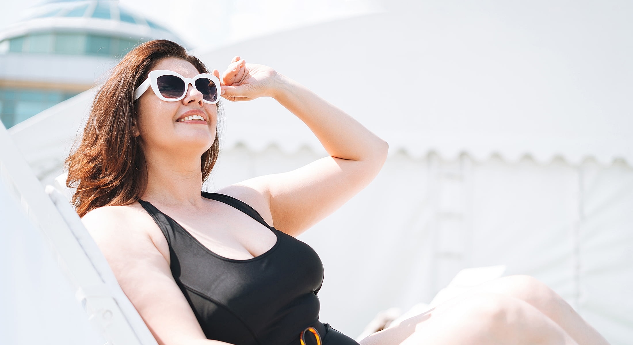 Person covered in gauze against a blue background.