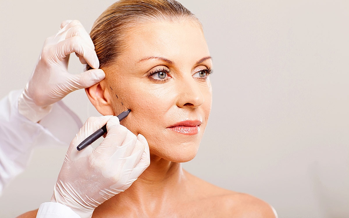 Cosmetic procedure preparation on a woman's face.