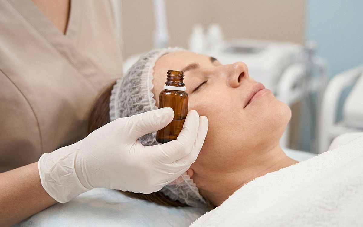 Applying skincare treatment in a spa setting.