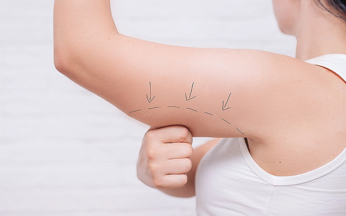 Demonstration of arm massage techniques for toning.