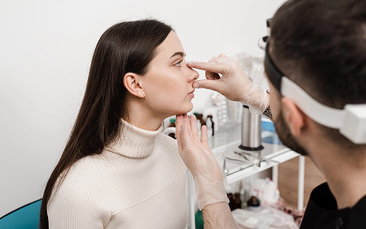 Consultation for cosmetic Rhinoplasty treatment in a clinic.